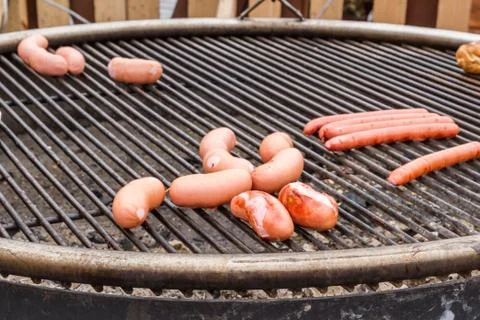 Sausages on the grill Stock Photos