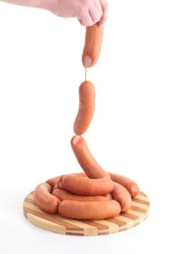 Sausages in hands Stock Photos