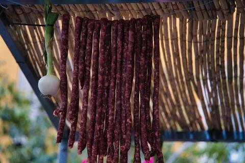 Sausages hanging on a string Stock Photos