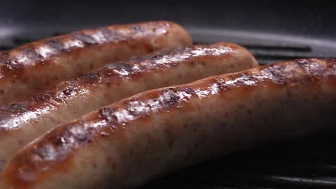 Sausages on a hot grill. Stock Footage 254524864