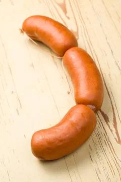 Sausages on kitchen table Foto stock
