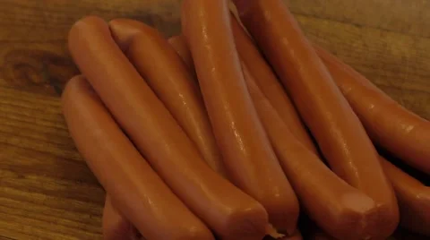 Sausages on an old rustic wooden table Video stock 54317748