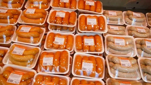 Sausages in packs on a showcase Video stock 105080146
