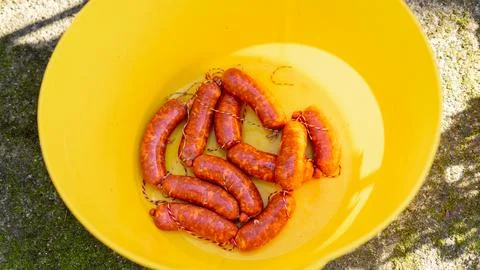 Sausages in a plastic drum Stock Photos
