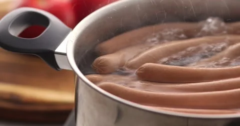 Sausages in a pot of boiling water. Stock Footage 249595004
