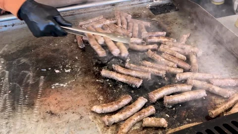 Sausages roast on grill griddle Stock Footage 274030993