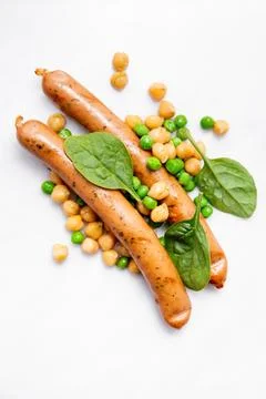 Sausages with vegetables Stock Photos