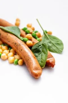 Sausages with vegetables Stock Photos