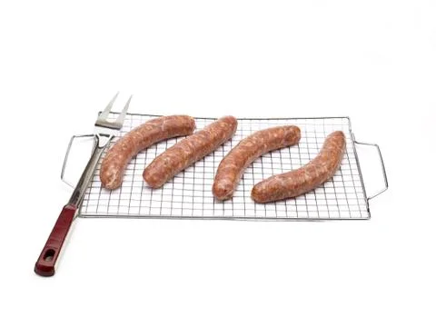 Sausages on a wire rack Stock Photos