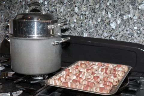 Sausages wraped in bacon Stock Photos