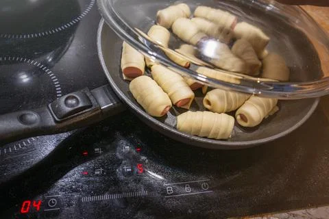 Sausages wrapped in dough, close-up Stock Photos