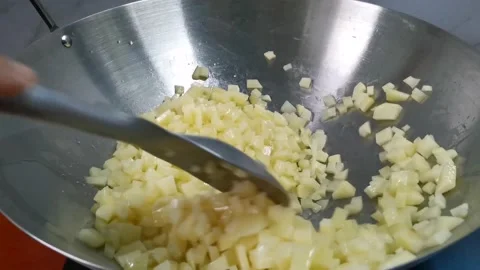 Saute Diced Potatoes in a Wok Stock Footage 162879928