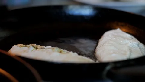 Sauté home-made donuts in boiling vegetable oil. Stock Footage 128241197
