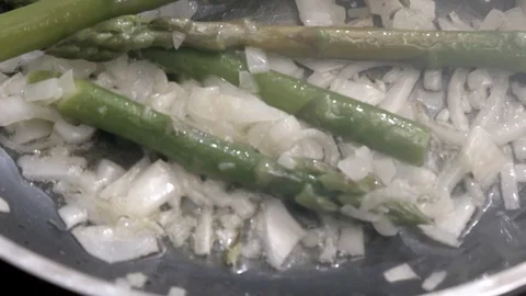 Sautéed with asparagus Stock Footage 93730927