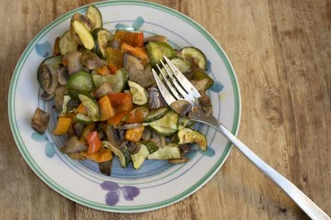 Sauteed mixed vegetables with fork on plate for healthy meal Stock Photos