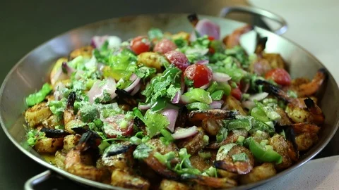 Sauteed or seared shrimp dish with detailed vegetables on top 1 Stock Footage 123875191