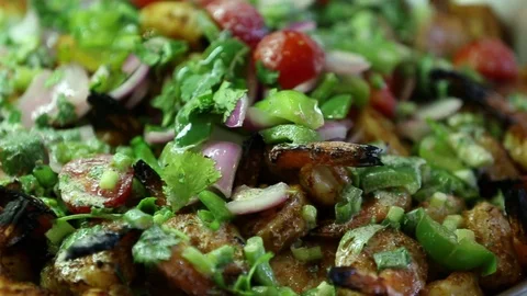 Sauteed or seared shrimp dish with detailed vegetables on top 3 Stock Footage 123875989