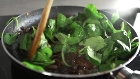 Sauteed Spinach with Onions. Stock Footage 305808559