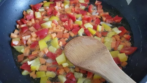 Sautéed vegetables in a pan Stock Footage 119834430