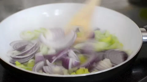 Sauteeing onion and leek Stock Footage 45534583