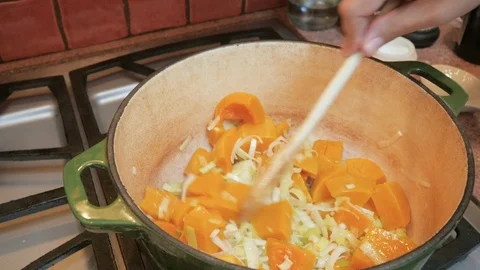 Sautéing Butternut Squash and Leeks to Make Vegetable Soup in 4k Stock Footage 86449054