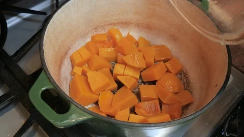 Sautéing Butternut Squash Cubes in a Dutch Oven in 4k Stock Footage 86255985