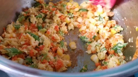 Sauteing Corn Grain and Puree with Minced Carrots and Beans Stock Footage 236774439