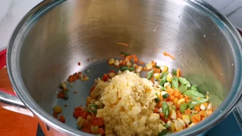 Sauteing Corn Puree Blended in a Blender into Carrots and Beans in a Casserole Stock Footage 236774414