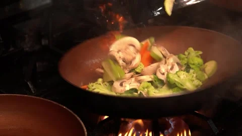 Sautéing Fresh Vegetables Stock Footage 318303577