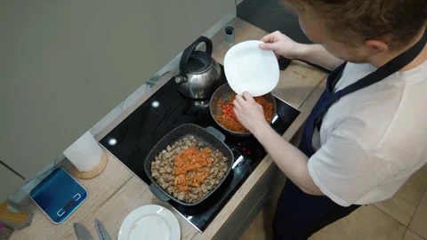 Sauteing Meat and Vegetables Stock Footage 310411504