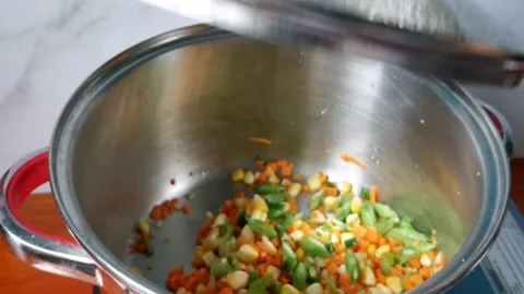 Sauteing Mixed Vegetables With Corn, Carrots and Green Beans Stock Footage 236774312