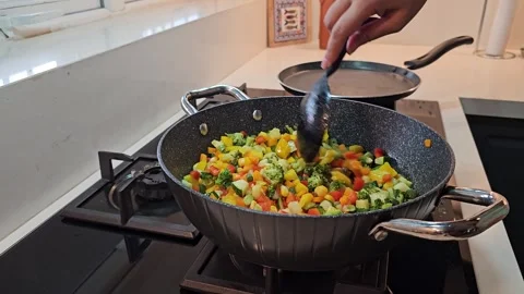 Sauteing Mixed Vegetables in Pan for Pasta Preparation Stock Footage 345163750