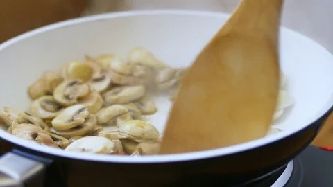 Sautéing mushrooms Stock Footage 70280685