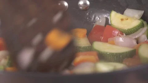 Sauteing Vegetables Closeup Shot Vídeo Stock 76994804