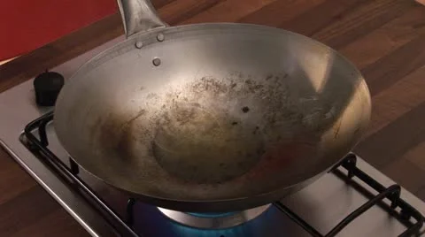 Sauteing vegetables in a wok Stock Footage 24634420