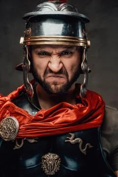 Savage and anrgy roman warrior with armour Stock Photos