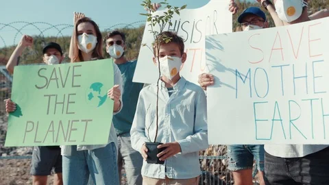 Save and restore nature. Young people taking part in ecology movement against Stock Footage 113926207