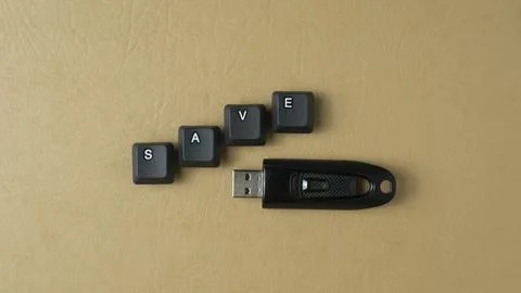 Save Data Concept With USB Drive And Keyboard Keys Stock Photos