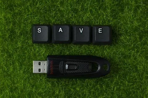 Save Data Concept With USB Drive On Green Grass 库存照片