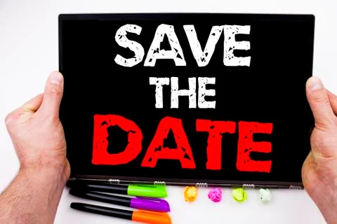 Save The Date text written on tablet, computer in the office with marker, pen Stock Photos