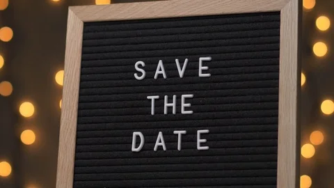SAVE THE DATE Words on a Black Letter Board Message Sign 库存影片 93699045