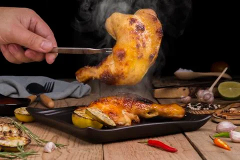 Save is doing a grilled chicken menu With rosemary lemon tomato spices and sa Stock Photos