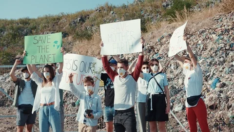 Save Earth and environment. View of vigorous brave young people participating in Stock Footage 113926066
