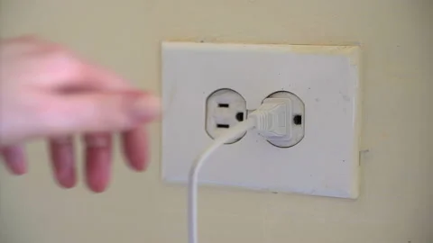 Save energy by unplugging devices. Charge electrical products and unplug them af Stock Footage 132749187