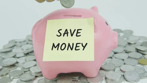 Save Money Word Or Text on Yellow Note Paper and Hand Inserting Coins Stock Footage 301528535