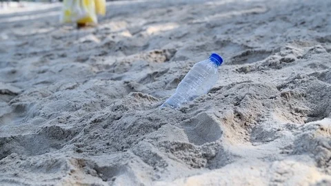 Save nature;Kid keep plastic water bottle on beach, Stock-Footage 127039650