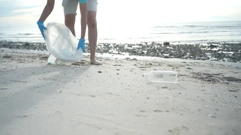 Save ocean. Volunteer pick up trash garbage at the beach and plastic bottle.. Stock Footage 336560707