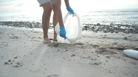 Save ocean. Volunteer pick up trash garbage at the beach and plastic bottle.. Stock Footage 340536502