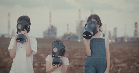 Save our planet - children with gas masks near a big oil refinery Video stock 80808469