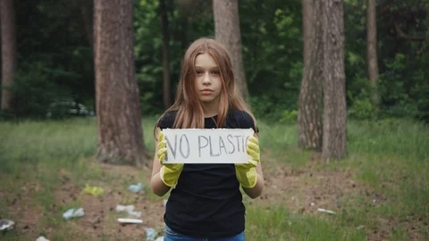 Save the planet for future. Portrait of a sweet teen girl showing a sign Stock Footage 112167439